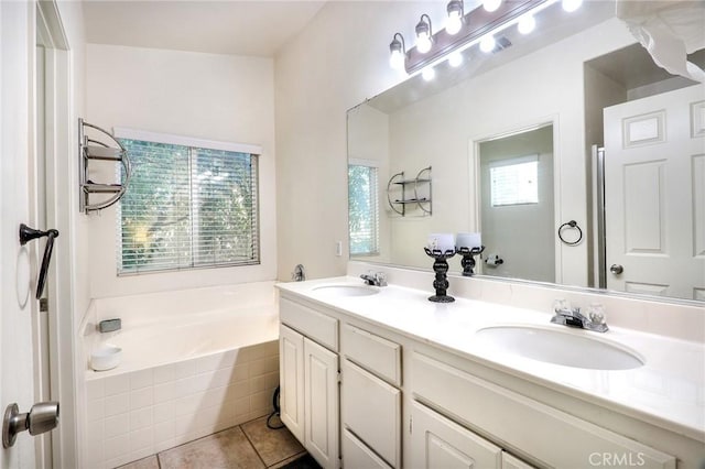 3738 Springmount St, Riverside, CA 92501 - bathroom featuring double vanity, a bath, and tile patterned flooring