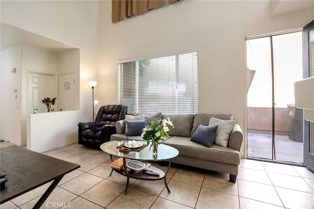 3738 Springmount St, Riverside, CA 92501 - living area featuring healthy amount of natural light, light tile patterned flooring, and a towering ceiling