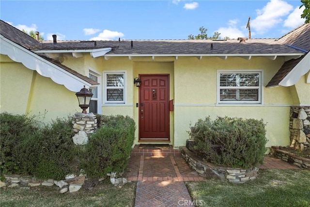 22941 Keswick St, West Hills, CA 91304 - doorway to property featuring stucco siding and roof with shingles
