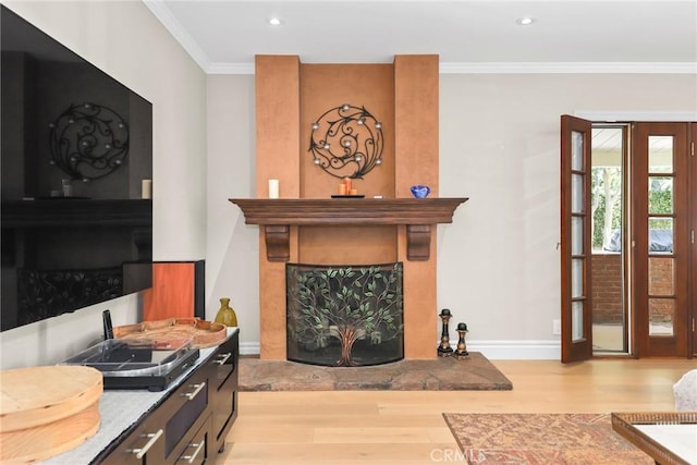 22941 Keswick St, West Hills, CA 91304 - living area with light wood finished floors, a large fireplace, crown molding, baseboards, and recessed lighting