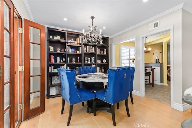 22941 Keswick St, West Hills, CA 91304 - dining room featuring a chandelier, light wood finished floors, crown molding, recessed lighting, and baseboards