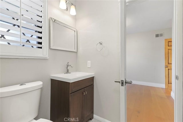 22941 Keswick St, West Hills, CA 91304 - bathroom featuring vanity, toilet, baseboards, and wood finished floors