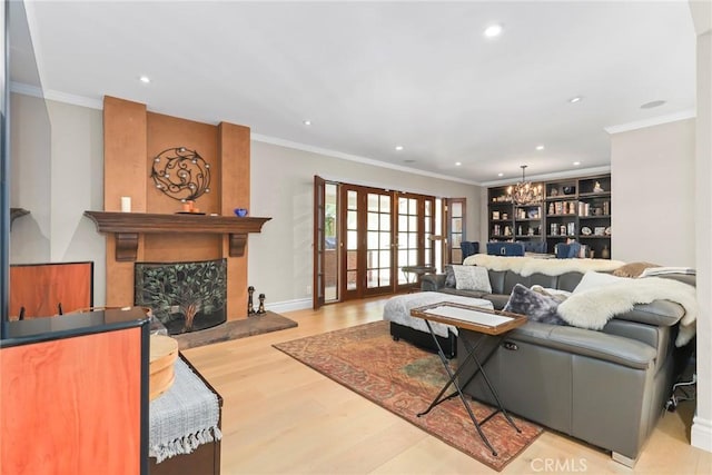 22941 Keswick St, West Hills, CA 91304 - living room featuring a chandelier, a fireplace, wood finished floors, recessed lighting, and ornamental molding