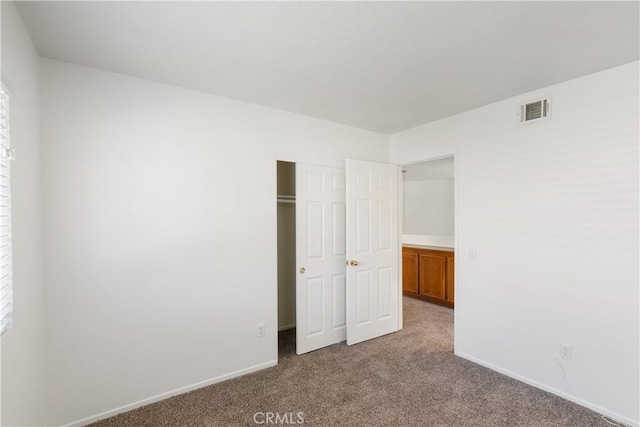 21965 Jeffers Ln, Saugus, CA 91350 - unfurnished bedroom featuring carpet, baseboards, a closet, and multiple windows