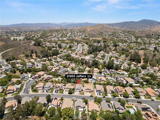 21965 Jeffers Ln, Saugus, CA 91350 - aerial view of property's location with a mountainous background and nearby suburban area