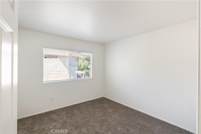 21965 Jeffers Ln, Saugus, CA 91350 - empty room with dark colored carpet and baseboards