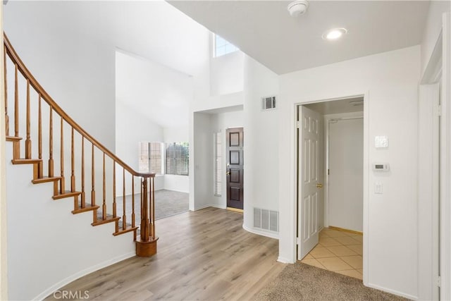 21965 Jeffers Ln, Saugus, CA 91350 - foyer with stairway, baseboards, a towering ceiling, wood finished floors, and recessed lighting