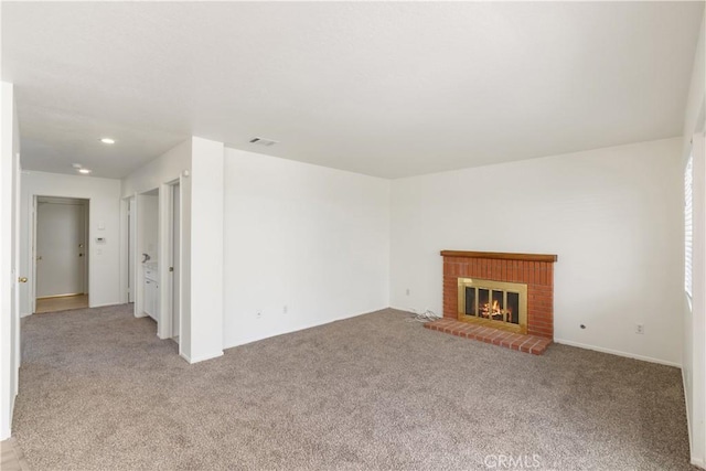 21965 Jeffers Ln, Saugus, CA 91350 - unfurnished living room with light colored carpet, a brick fireplace, and recessed lighting