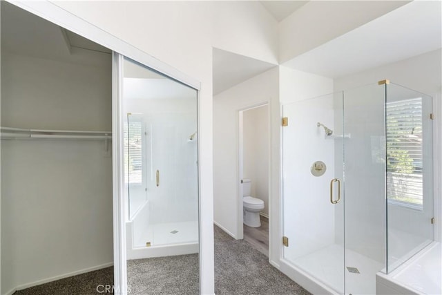 21965 Jeffers Ln, Saugus, CA 91350 - full bath featuring a shower stall, toilet, a walk in closet, and baseboards