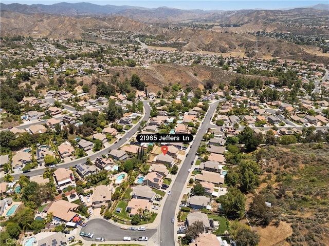 21965 Jeffers Ln, Saugus, CA 91350 - aerial view of property's location with a mountainous background and nearby suburban area