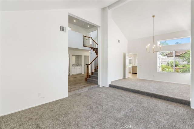 21965 Jeffers Ln, Saugus, CA 91350 - unfurnished living room with high vaulted ceiling, carpet flooring, a chandelier, stairs, and beamed ceiling