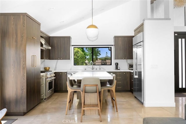 2305 Henrietta Ave, La Crescenta, CA 91214 - kitchen with high end appliances, light countertops, wall chimney range hood, a breakfast bar area, and a center island