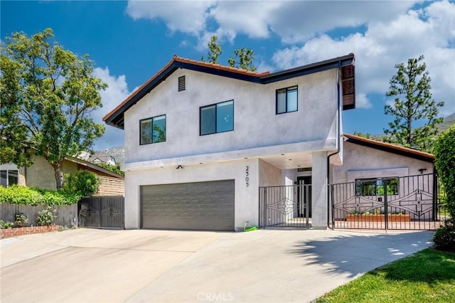 2305 Henrietta Ave, La Crescenta, CA 91214 - contemporary home featuring a gate, a garage, stucco siding, and concrete driveway