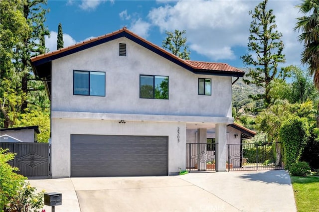 2305 Henrietta Ave, La Crescenta, CA 91214 - view of front facade featuring a gate, stucco siding, and an attached garage