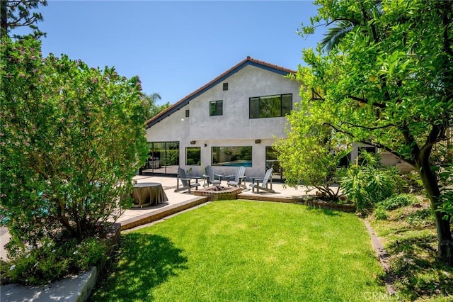 2305 Henrietta Ave, La Crescenta, CA 91214 - back of house featuring stucco siding, a patio area, and a lawn