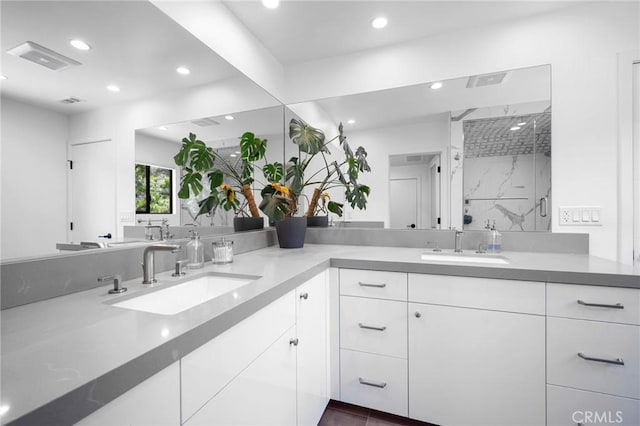 2305 Henrietta Ave, La Crescenta, CA 91214 - bathroom with double vanity, a marble finish shower, and recessed lighting
