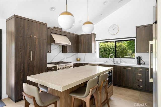 2305 Henrietta Ave, La Crescenta, CA 91214 - kitchen featuring a sink, extractor fan, a kitchen breakfast bar, dark brown cabinets, and light countertops