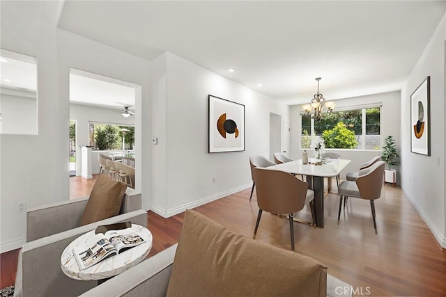 21 Mykonos, Laguna Niguel, CA 92677 - dining room with wood finished floors, plenty of natural light, a chandelier, baseboards, and recessed lighting