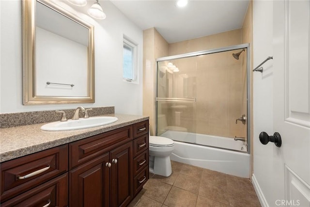 21 Mykonos, Laguna Niguel, CA 92677 - full bath featuring vanity, toilet, tile patterned flooring, and bath / shower combo with glass door