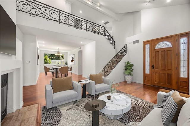 21 Mykonos, Laguna Niguel, CA 92677 - entrance foyer featuring light wood-style floors, stairs, a chandelier, recessed lighting, and high vaulted ceiling