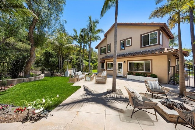 21 Mykonos, Laguna Niguel, CA 92677 - back of house featuring an outdoor living space with a fire pit, a tiled roof, stucco siding, and a patio