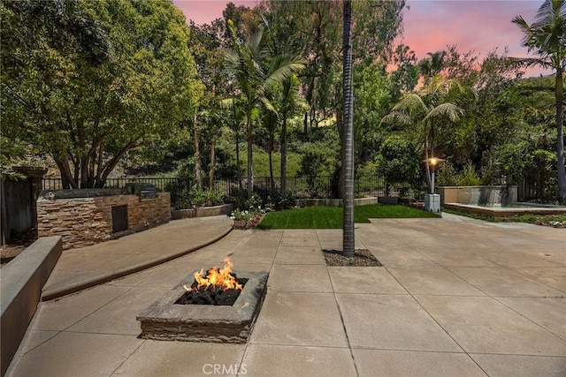21 Mykonos, Laguna Niguel, CA 92677 - patio terrace at dusk featuring a fire pit and a patio