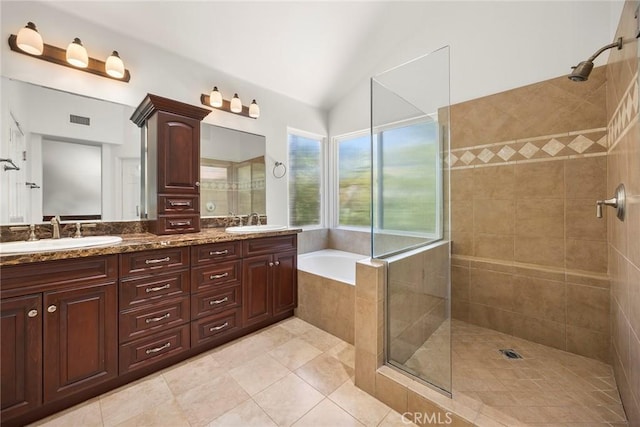 21 Mykonos, Laguna Niguel, CA 92677 - bathroom featuring tiled shower, lofted ceiling, double vanity, a garden tub, and tile patterned flooring