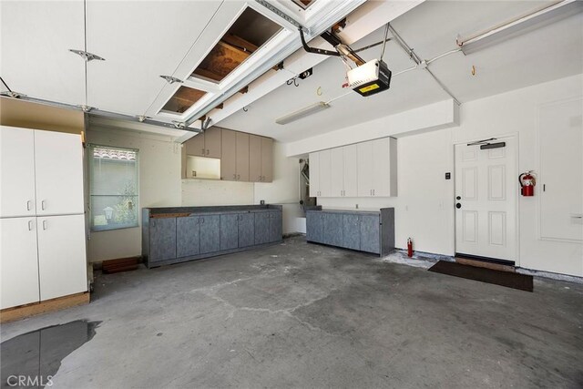 21 Mykonos, Laguna Niguel, CA 92677 - garage featuring a garage door opener