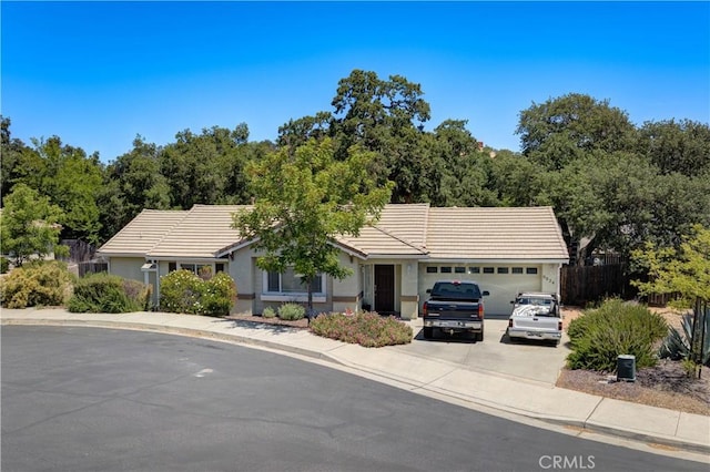 9024 Cascada Rd, Atascadero, CA 93422 - view of front facade with an attached garage, a tiled roof, and driveway