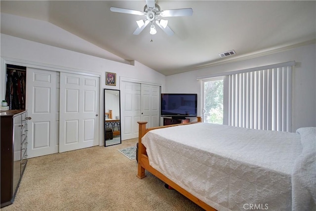 9024 Cascada Rd, Atascadero, CA 93422 - bedroom featuring vaulted ceiling, multiple closets, light carpet, and ceiling fan