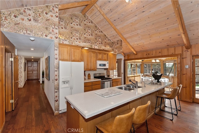 531 Killington Way, Big Bear Lake, CA 92315 - kitchen with white appliances, a sink, dark wood finished floors, wooden ceiling with exposed beams, and a breakfast bar