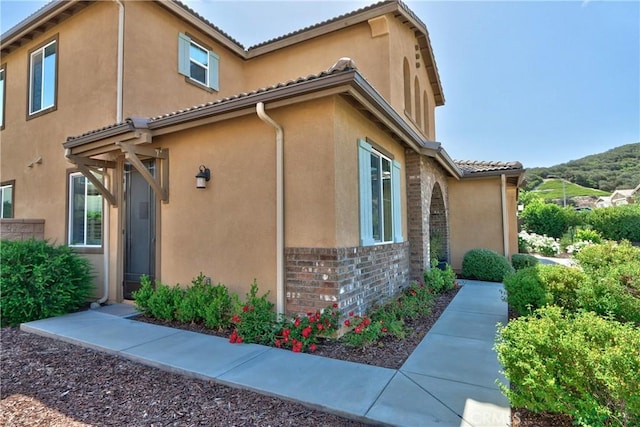 45668 Nora Cir, Temecula, CA 92592 - view of property exterior with stucco siding and a tiled roof