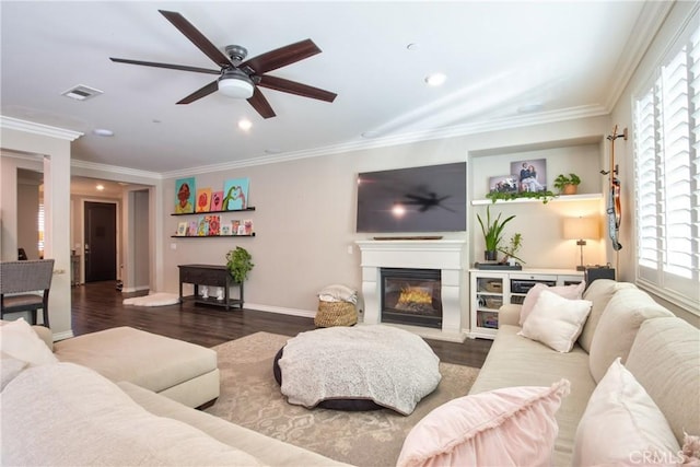 45668 Nora Cir, Temecula, CA 92592 - living area with plenty of natural light, ceiling fan, a glass covered fireplace, baseboards, and ornamental molding