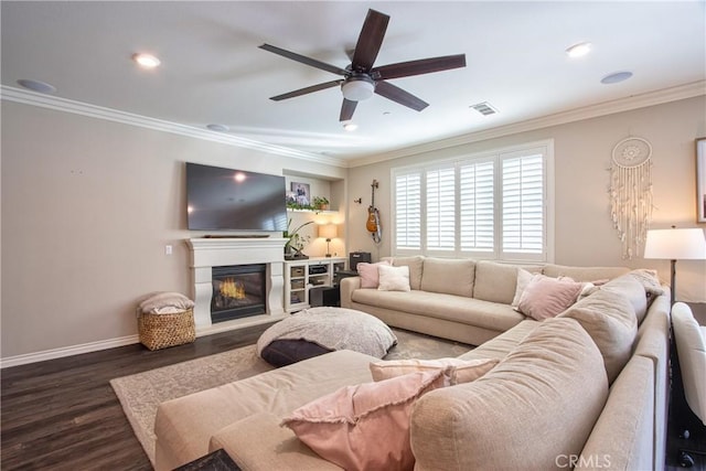 45668 Nora Cir, Temecula, CA 92592 - living area featuring a ceiling fan, dark wood-style flooring, crown molding, a glass covered fireplace, and recessed lighting