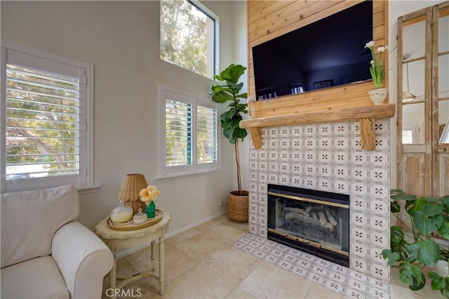 6456 Twinberry Cir, Avila Beach, CA 93424 - tiled living room with a tile fireplace and baseboards