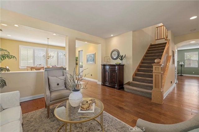 26520 Thackery Ln, Stevenson Ranch, CA 91381 - living room with wood finished floors, stairway, recessed lighting, arched walkways, and a chandelier