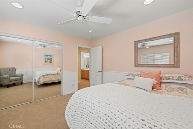 26520 Thackery Ln, Stevenson Ranch, CA 91381 - bedroom with light colored carpet, a wainscoted wall, a closet, recessed lighting, and ceiling fan