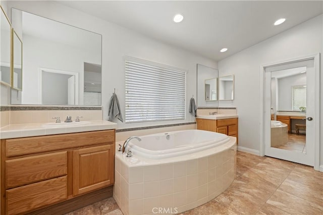 26520 Thackery Ln, Stevenson Ranch, CA 91381 - full bath with two vanities, a bath, and recessed lighting