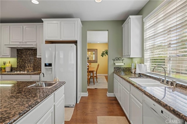 26520 Thackery Ln, Stevenson Ranch, CA 91381 - kitchen featuring white appliances, white cabinets, light wood finished floors, recessed lighting, and under cabinet range hood