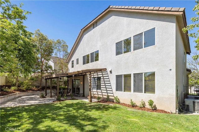 26520 Thackery Ln, Stevenson Ranch, CA 91381 - rear view of house with stucco siding and a patio area