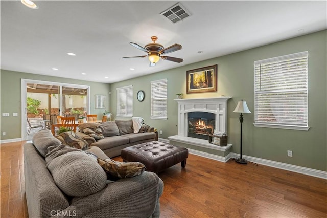 26520 Thackery Ln, Stevenson Ranch, CA 91381 - living area featuring ceiling fan, wood finished floors, a glass covered fireplace, and recessed lighting