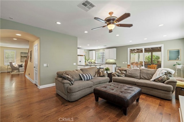 26520 Thackery Ln, Stevenson Ranch, CA 91381 - living room with hardwood / wood-style flooring, arched walkways, a ceiling fan, and recessed lighting