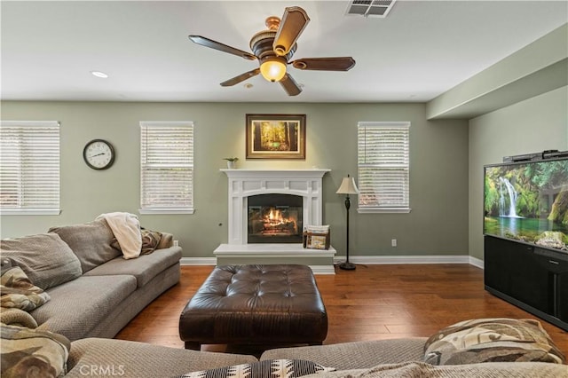 26520 Thackery Ln, Stevenson Ranch, CA 91381 - living area with ceiling fan, a glass covered fireplace, wood finished floors, and recessed lighting