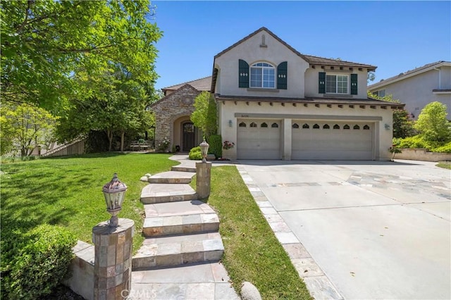 26520 Thackery Ln, Stevenson Ranch, CA 91381 - view of front of home featuring stucco siding, a garage, driveway, and a front lawn