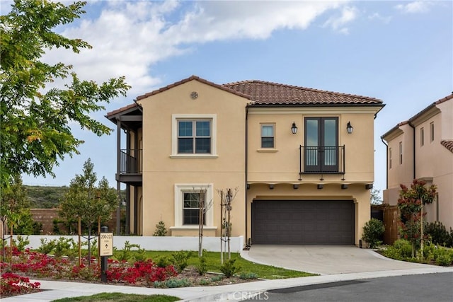200 Canterbury, Irvine, CA 92618 - mediterranean / spanish house with a balcony, stucco siding, a tiled roof, and an attached garage