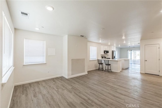 1325 Deodara Way, Paradise, CA 95969 - living room featuring light wood-type flooring, baseboards, and recessed lighting