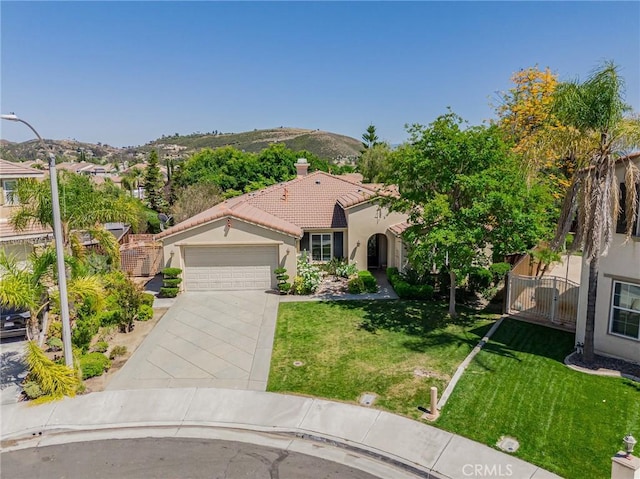 36702 Doreen Dr, Murrieta, CA 92563 - mediterranean / spanish-style house with stucco siding, a garage, a tiled roof, concrete driveway, and a front lawn