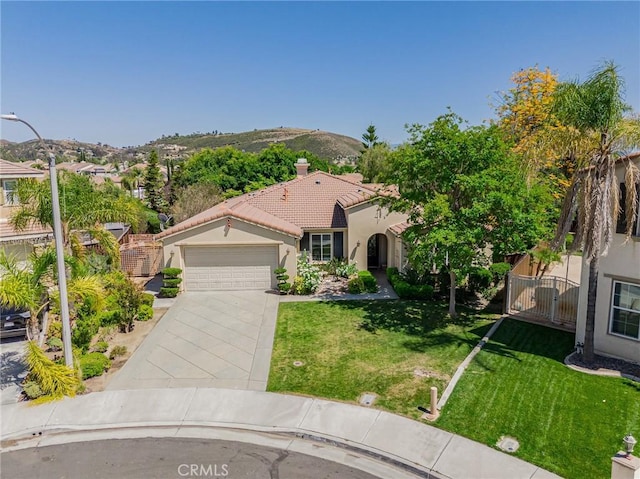 36702 Doreen Dr, Murrieta, CA 92563 - mediterranean / spanish-style house with stucco siding, a garage, concrete driveway, a tiled roof, and a chimney
