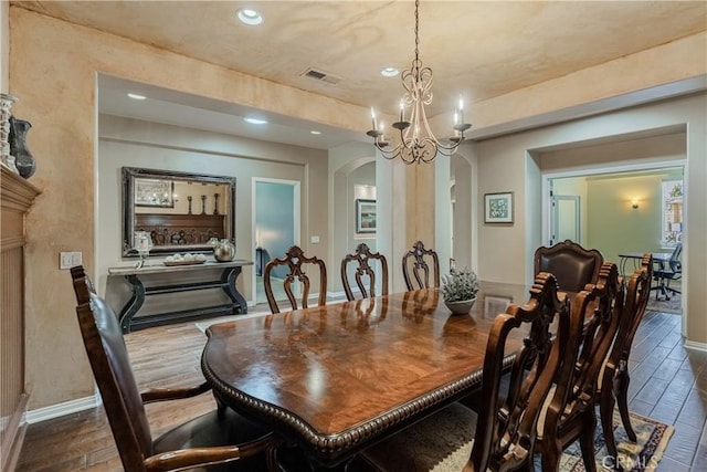36702 Doreen Dr, Murrieta, CA 92563 - dining room with arched walkways, recessed lighting, wood finished floors, and a chandelier