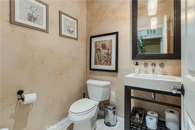 36702 Doreen Dr, Murrieta, CA 92563 - bathroom featuring toilet, a sink, and tile patterned floors